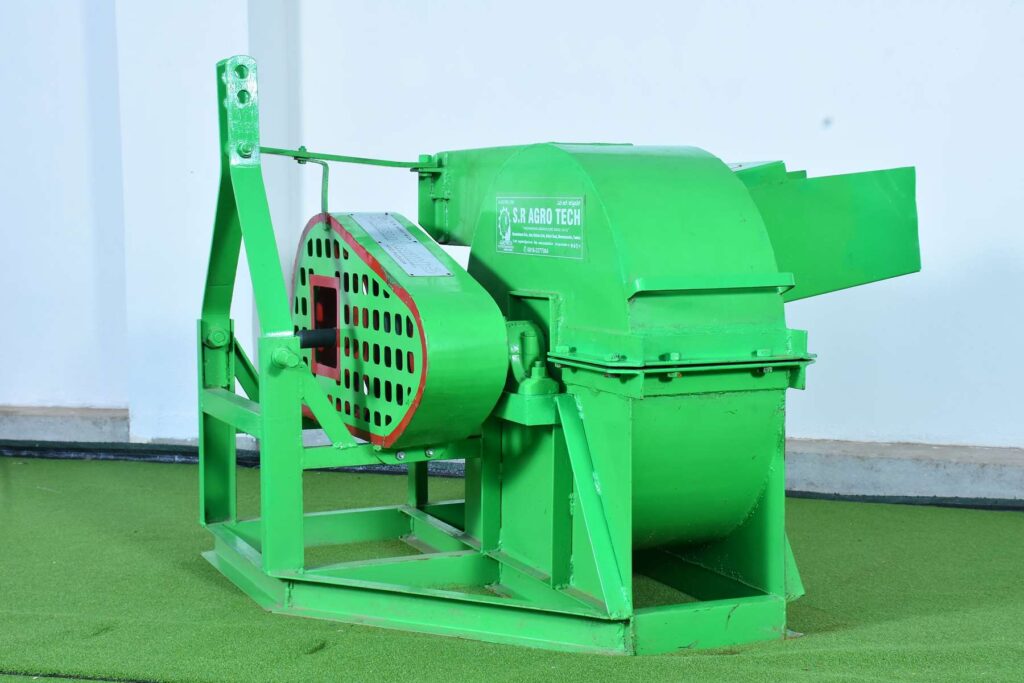 Image of a tractor-operated shredder machine in action. The machine is attached to a tractor and is efficiently shredding agricultural residues and organic materials."